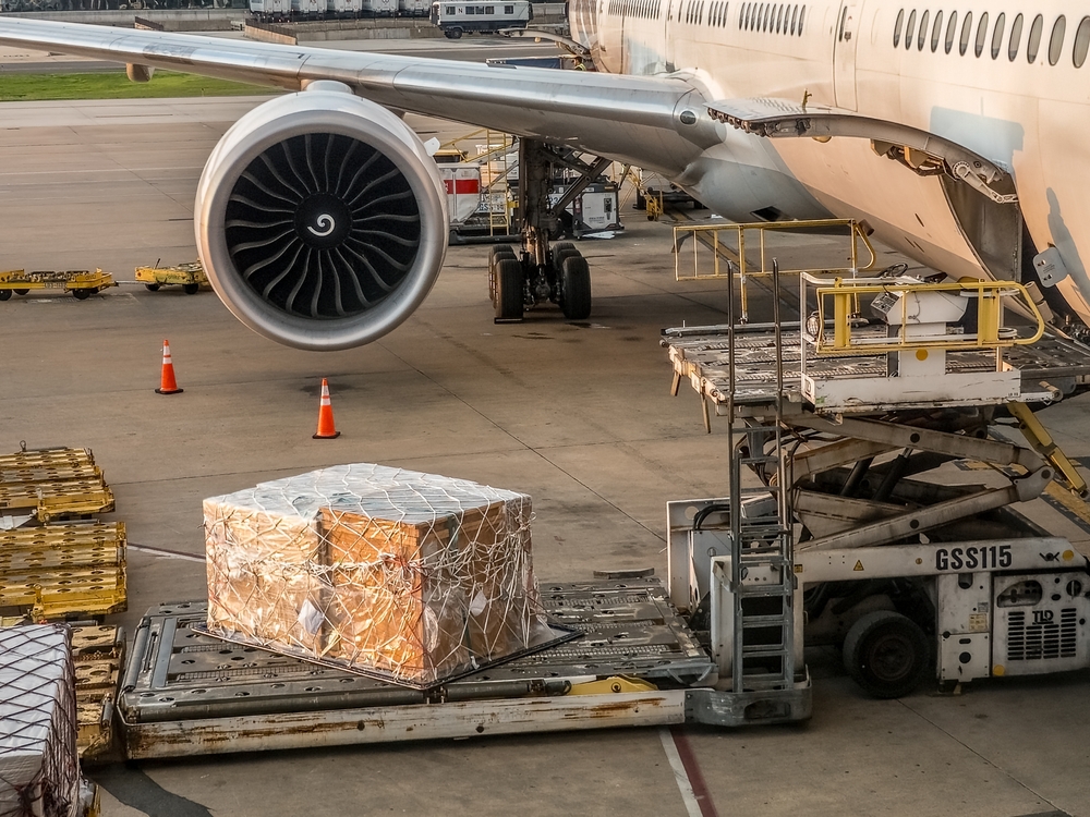 Our services cargo,,containers,and,pallets,are,unloaded,from,a,commercial,aircraft